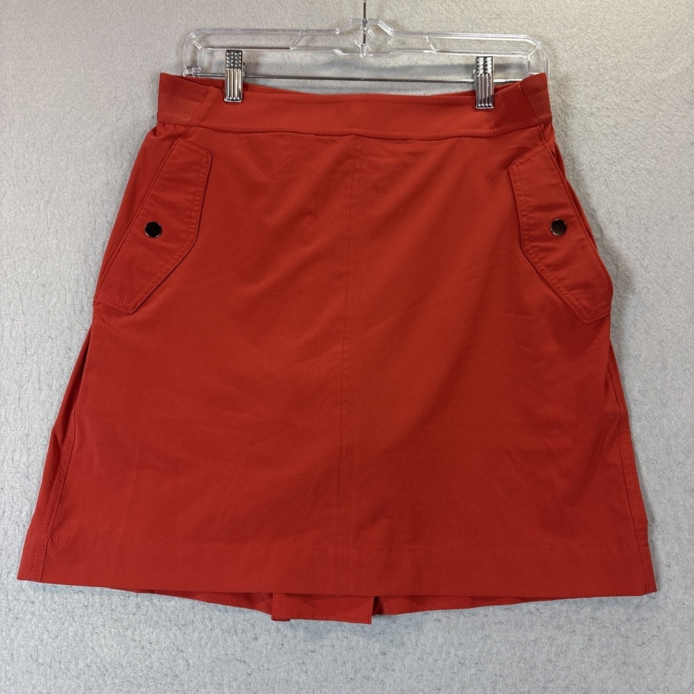Athleta Trekkie Skort in a burnt orange color flap pocket stretch outdoor Sz 10